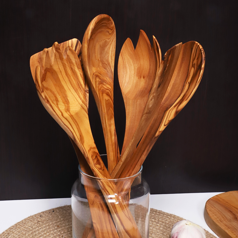 Art Olive olive wood cooking utensils set in use, lifestyle photo
